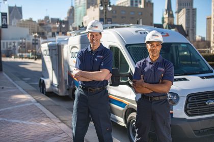 DUCTZ technicians in front of vans
