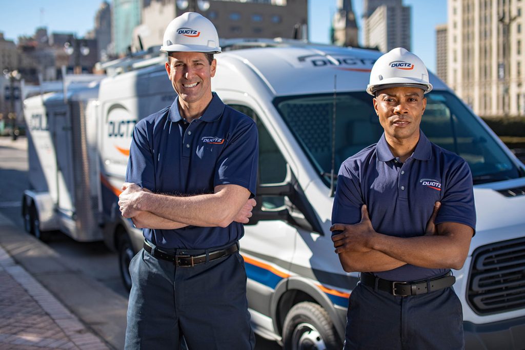 DUCTZ technicians in front of vans hvac franchise opportunity