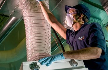 DUCTZ franchise technician cleaning air duct
