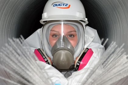 DUCTZ Franchise employee cleaning inside a duct